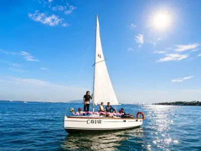 The 5 Pax Sailing Boat under full sail with guests aboard, named Caviar
